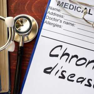 Stethoscope next to a sheet of paper with "Chron's disease" on it.